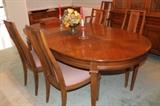Dining table with two additional leaves and a table pad, and six chairs.