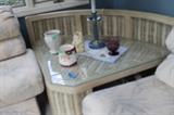 Wicker corner table.