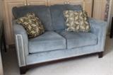 Loveseat with nail head detail.