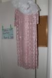 Pink formal dress, very lacy.