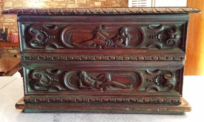 large antique carved chest, man and woman, nude in repose carved both sides