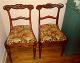 Two of six carved mahogany chairs