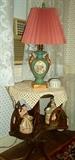 Mahogany rotating bookcase, porcelain lamp and figurines