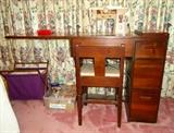 Singer sewing machine in cabinet