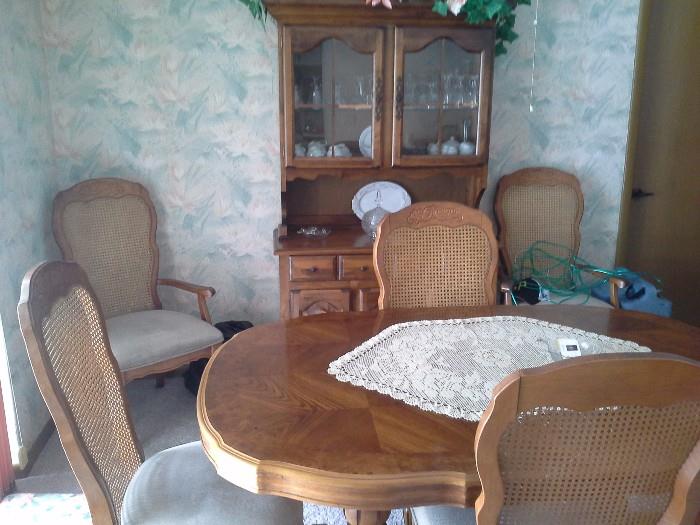 Vintage wood dining set with 6 cane back chairs