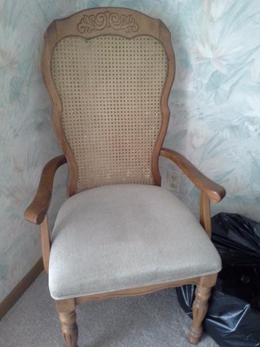 Upholstered cane back dining arm chair 