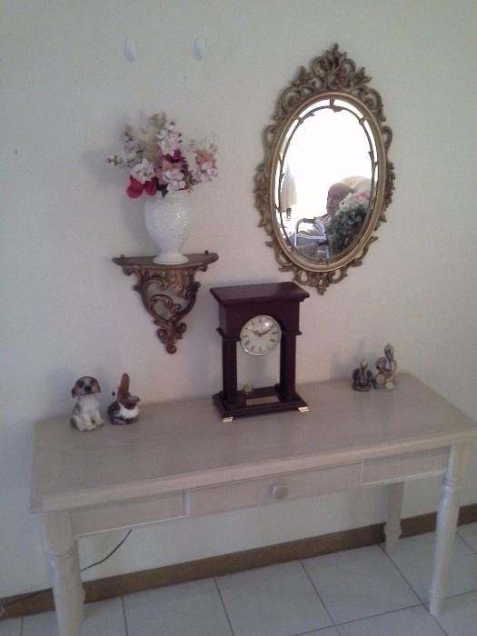 Wood entry table with drawer.  Mantle clock, Ornate vintage mirror, ornate shelf
