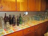 Canning jars and other assorted jars and bottles