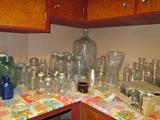 Canning jars and other assorted bottles