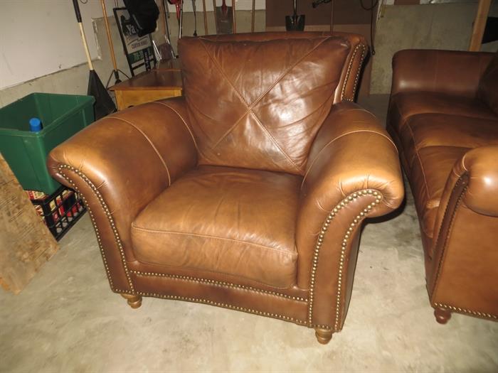 Brown leather armchair.(in the garage because of recent new carpeting.)