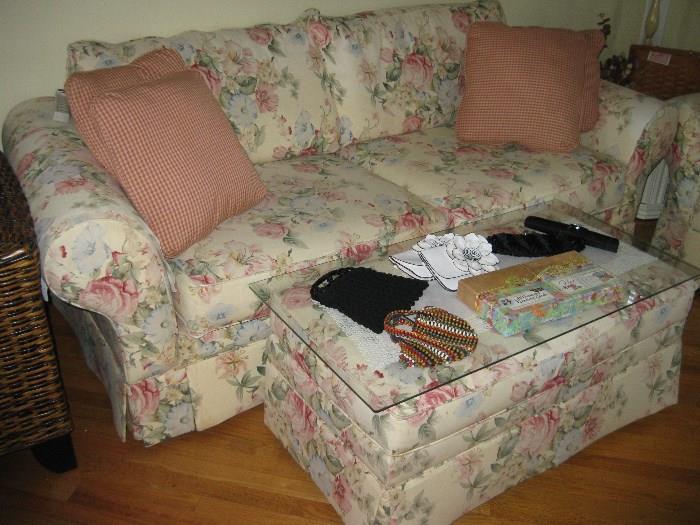 Lovely flowered sofa, chair and foot stool,(table), priced seperately