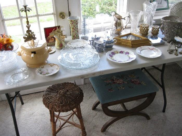 china, glass, a large variety of decorative items.  Needle point foot stool, and wicker stool