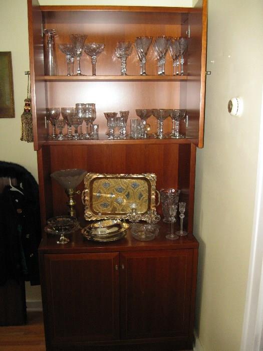 Teak wood cabinet with lovely crystal.  Fostoria, Cambridge, Heisey etc.