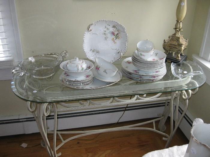 glass top console table with Rose dishes