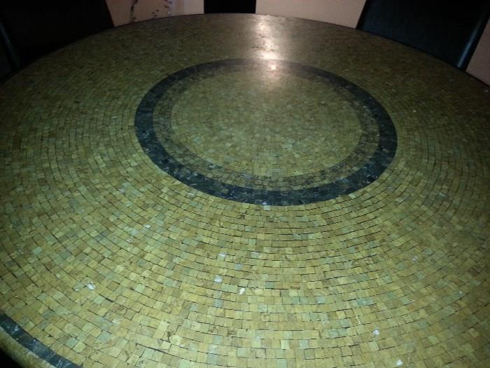 This is a round Italian mosaic marble table. Retailed at $1200 ...without the chairs. Set of 6 chairs. Beautiful in person. Asking $650