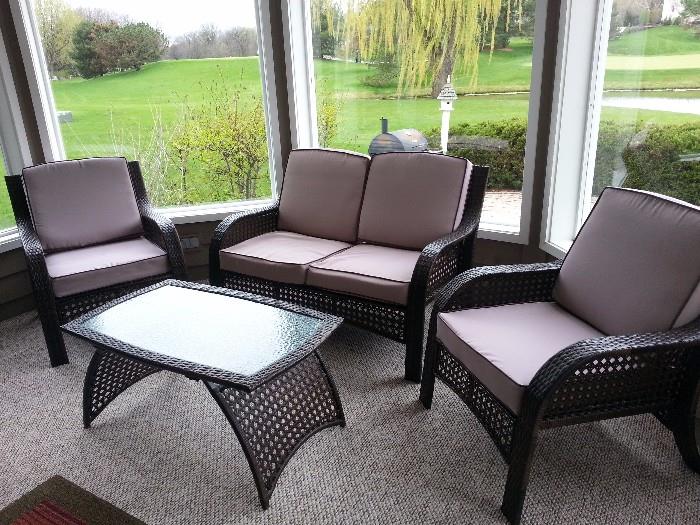 Four piece patio set includes loveseat, two chairs, and table.  $225