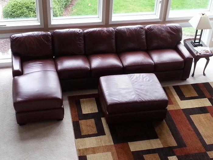 See how pretty this  L shaped sectional leather sofa is. Every cushion has Velcro so they do not slip and slide. Includes large matching Ottoman.  Pre-sell $750