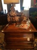          Three drawer side table; vintage lamp