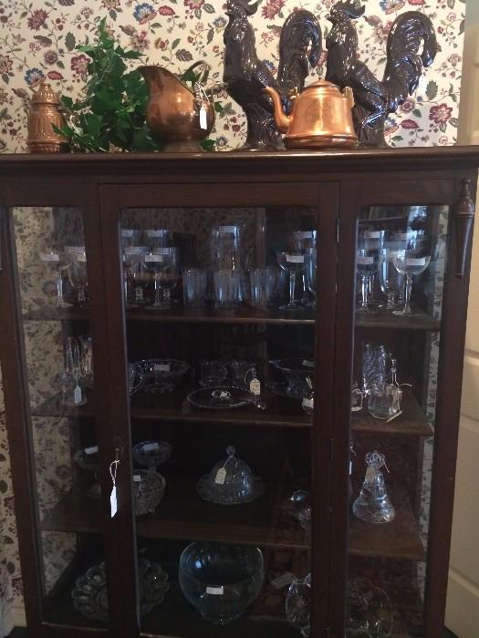          Antique display cabinet filled with crystal