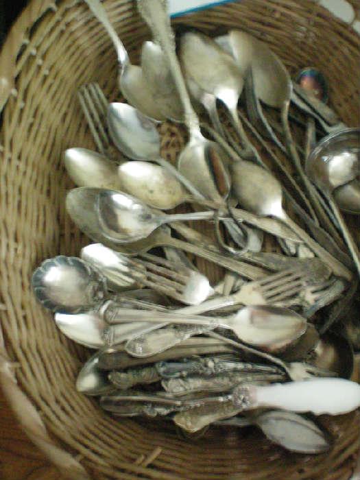 Lots of old silver-plated utensils
