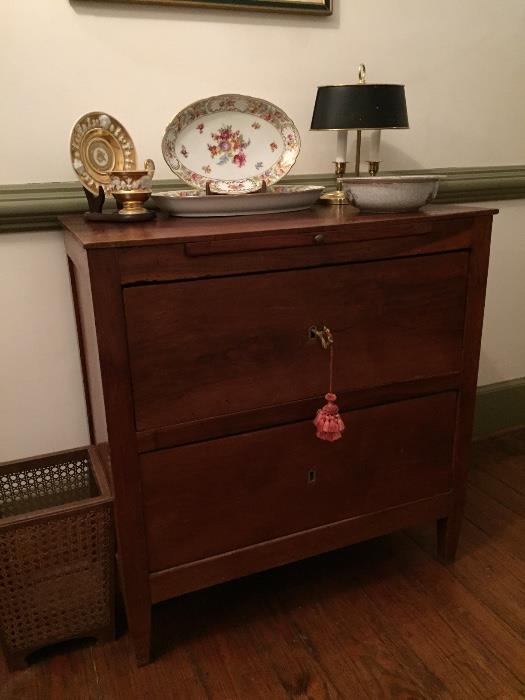 Late 19th century two drawer chest, Dresden china, and brass desk lamp.