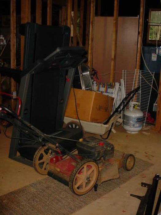One of the lawn mowers and the tread mill