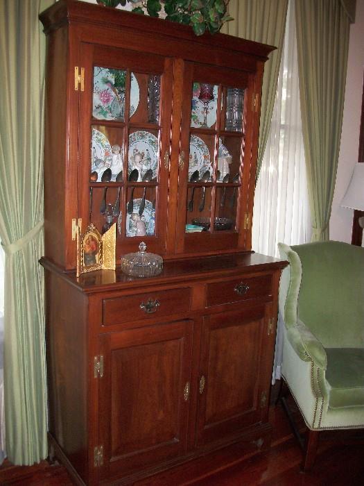 This handmade cupboard is a very rare find. Not only does it have a great look, but it has 3 plate racks and a spoon rack!