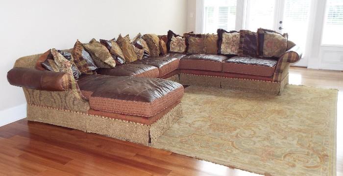 HUGE LEATHER (NEW WITH LAST 6 MONTHS) AND TAPESTRY SECTIONAL SOFA WITH ORIENTAL TYPE RUG