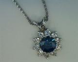 1ct irradiated  deep blue diamond pendant with .50ct white diamonds surrounding the center in 14k white gold with sterling chain