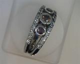 three cognac diamonds  weighing .54 ct with .38ct white diamonds in a 14k white gold band style ring