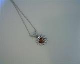 cognac diamond pendant and chain in 14k white gold.  .19ct cognac diamond surrounded by .10ct white diamonds