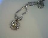 light fancy color diamond pendant and chain in 14k white gold.  .43ct center diamond with .24ct white diamonds