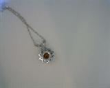 cognac diamond pendant and chain in 14k white gold.  .19ct cognac diamond surrounded by .10ct white diamonds
