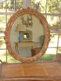 French Oval 18th Century Hand Carved and Gilt Frame with added mirror.