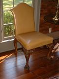 Two Early 19th Century Irish Heavily Carved Side Chairs upholstered in a beautiful leather.
