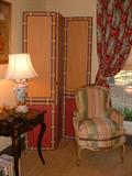 Japanned side table, three panel wallpaper screen along with a 19th Century Carved and painted French Closed Arm Chair with custom silk fabric.