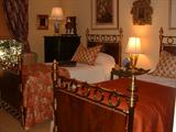 Beds, twin, brass with wood panel inserts, late 19th Century, most likely English.