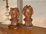 Two hand formed terracotta busts of children, 1947, signature is yet to be determined.