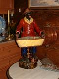 A Very Fine Majolica Figure holding a basket, 19th Century.