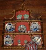 Carved Chinese Chippendale hanging wall shelf with fabric back, early 20th Century.