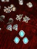 18K White Gold earrings with mounted shell diamond bands and Saphire Cabochons, White gold earrings with Bagettes and round Diamonds, White Gold Earrings with Diamonds and Blue Saphire bands, White Gold earrings with diamonds, 14K white gold turquoise and diamond earrings and ring.