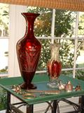 Large etched ruby glass vase, ruby glass flashed vase, collection of antique brass items and three pot metal figures.