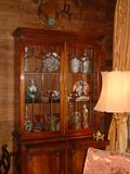 An English Mahogany cabinet with pull out writing surfaces and blind doors at bottom.