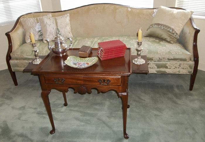 A wonderful top-of-the-line Hickory Chair Hepplewhite sofa/setee with long, single cushion.  The nice mahogany tea table has candle pulls plus a bonus drawer!  Definitely worth taking a look in living room!  