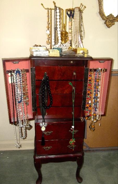 Beautiful jewelry cabinet in mahogany finish.