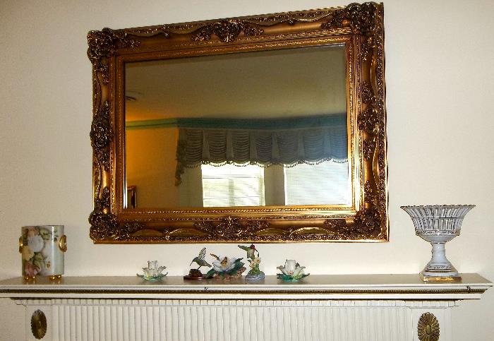 Strikingly beautiful mirror - could be used horizontally (as shown) or vertically.   Very nice frame in good condition.   Hand painted items displayed on mantle.