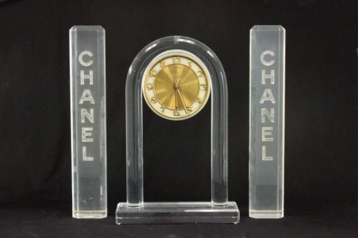 Lot #66 Lucite Chanel clock and stands