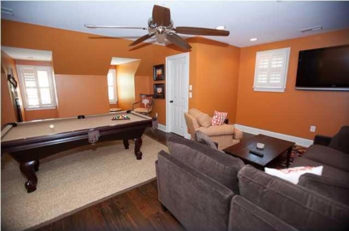 What a play room! Billiards table, L-shape couch, Flat Screen TV, and more!