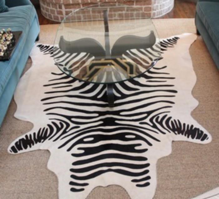 Neiman Marcus Zebra Hide Rug. Cowhide rug is stenciled with zebra stripes. 6x7