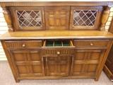 Vintage Buffet with leaded glass doors.  Drawer lined with velvet for silverware storage.